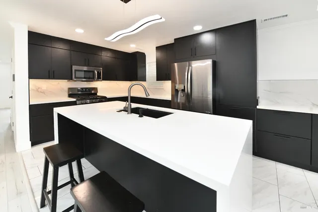 a kitchen with a stove and a microwave