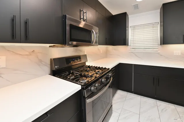 a kitchen with a sink and cabinets
