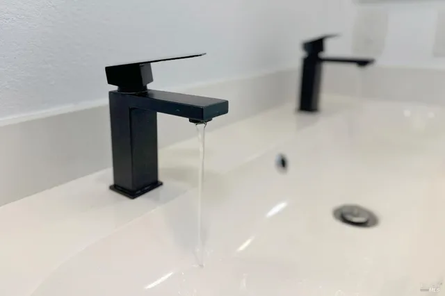 a kitchen with a sink and a large window