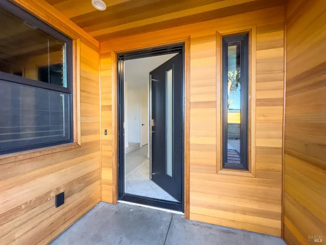 a view of a kitchen with a sink and a refrigerator