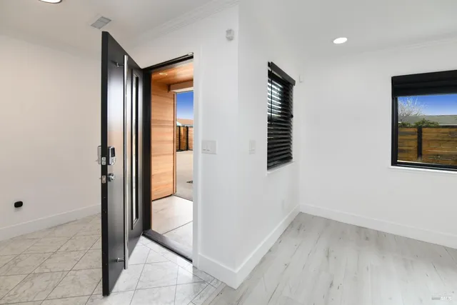 a kitchen with stainless steel appliances a sink and a refrigerator