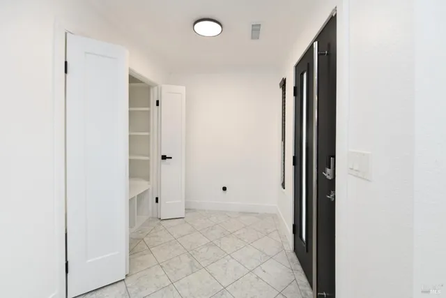 a kitchen with wooden cabinets and a stove top oven
