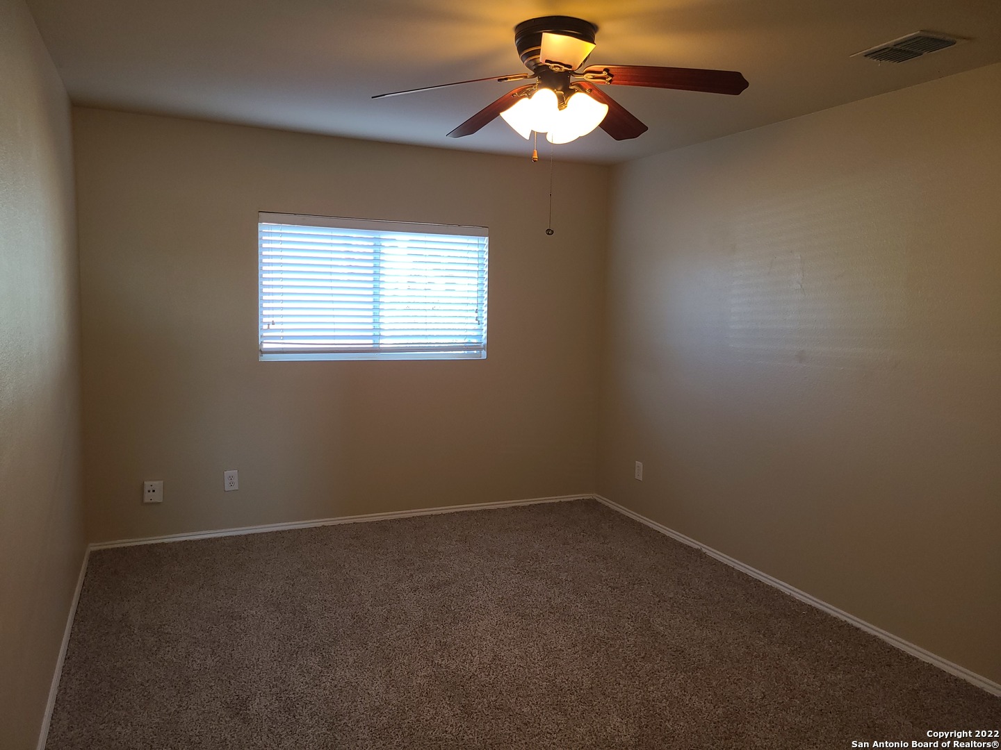 112 Willow Run Cibolo, TX 78108 - Photo 16 of 21 an empty room with a window and a fan