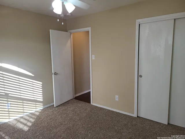 an empty room with a bathroom