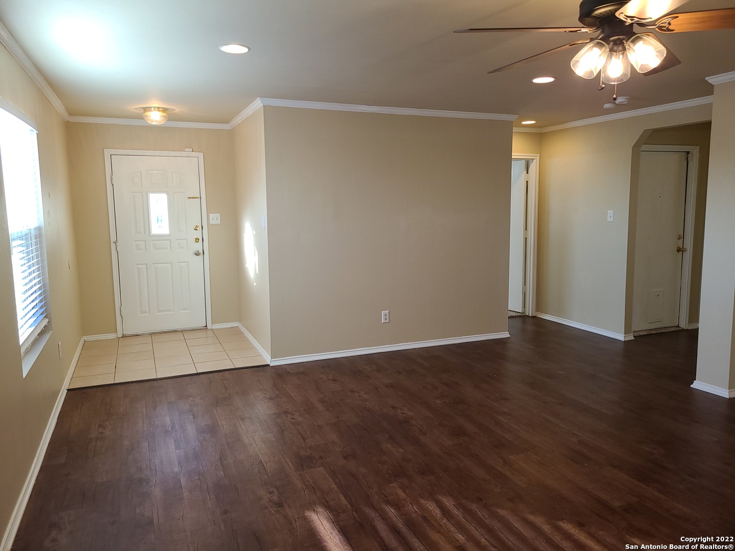 112 Willow Run Cibolo, TX 78108 - Photo 2 of 21 a view of an empty room with wooden floor and a window