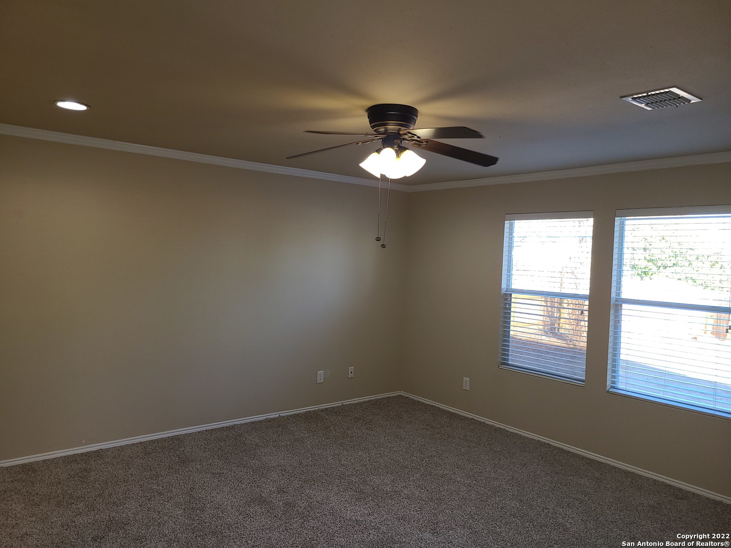 112 Willow Run Cibolo, TX 78108 - Photo 8 of 21 an empty room with a window and a ceiling fan