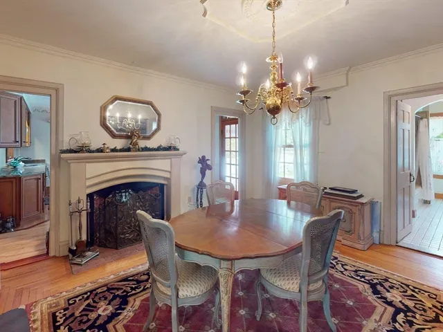 a large kitchen with stainless steel appliances granite countertop a stove a sink a microwave and dining table