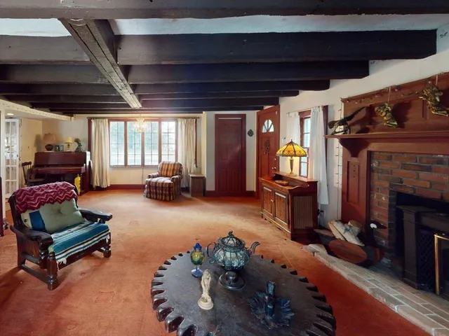 a bed room with furniture and a large window