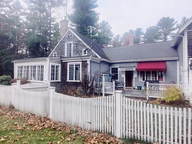 a kitchen with stainless steel appliances granite countertop a refrigerator and a stove