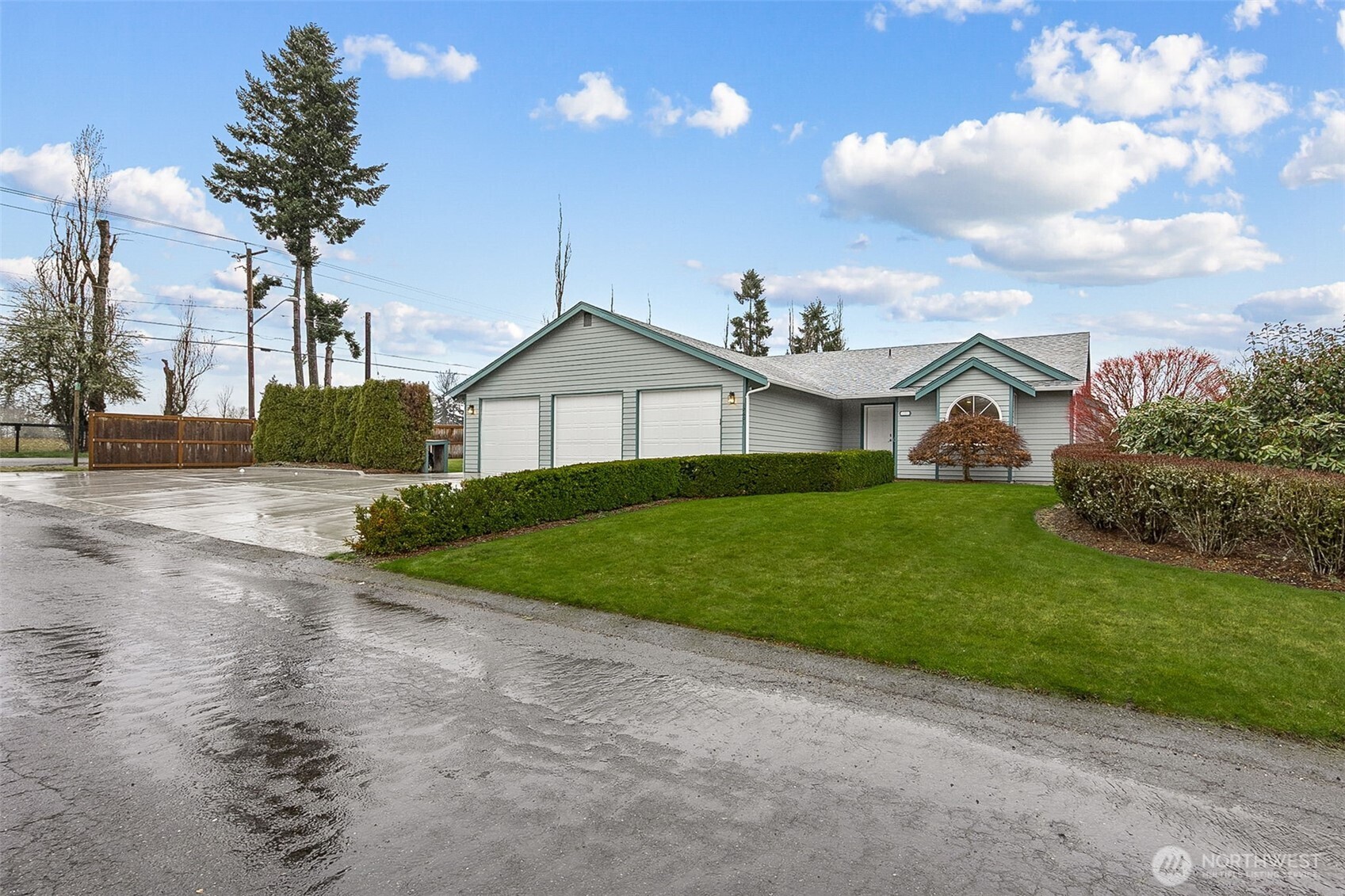 12601 227th Street East Graham, WA 98338 - Photo 1 of 27 a front view of a house with garden