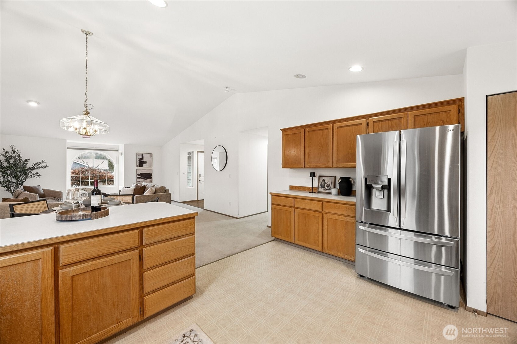12601 227th Street East Graham, WA 98338 - Photo 13 of 27 a kitchen with a sink stainless steel appliances and cabinets