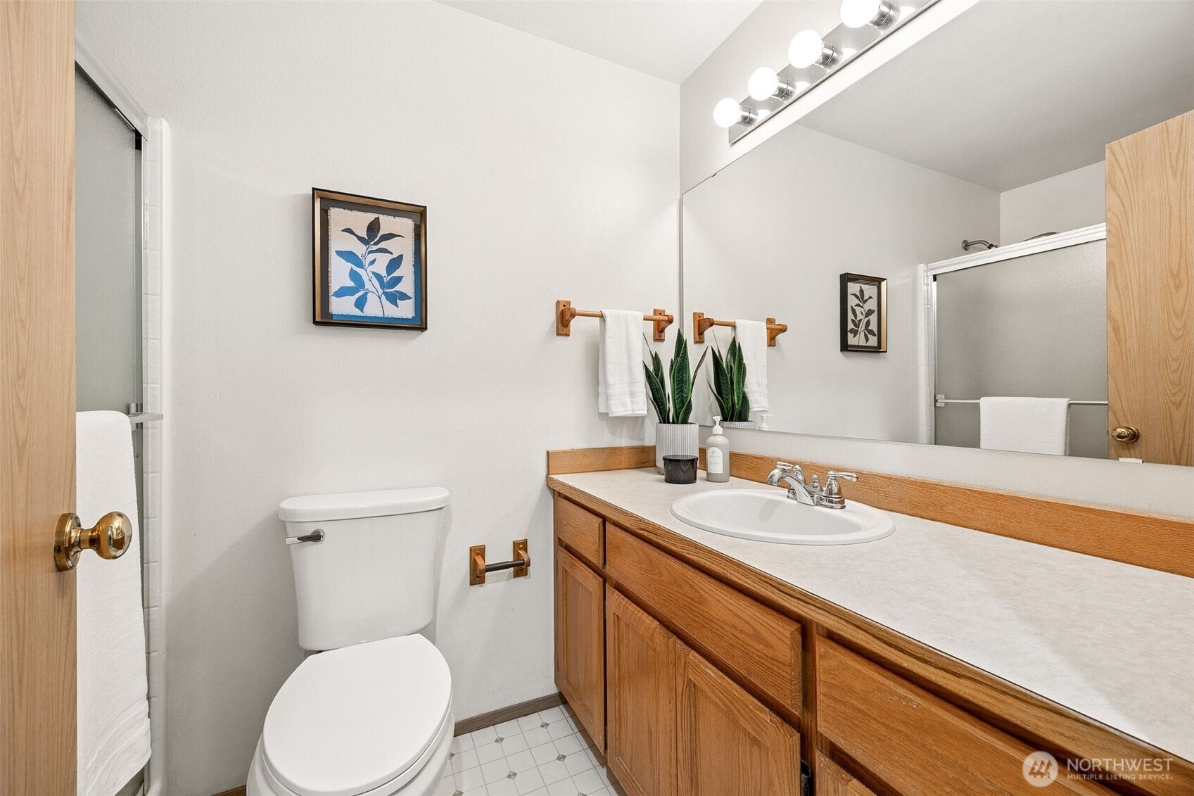 12601 227th Street East Graham, WA 98338 - Photo 15 of 27 a bathroom with a toilet sink and mirror