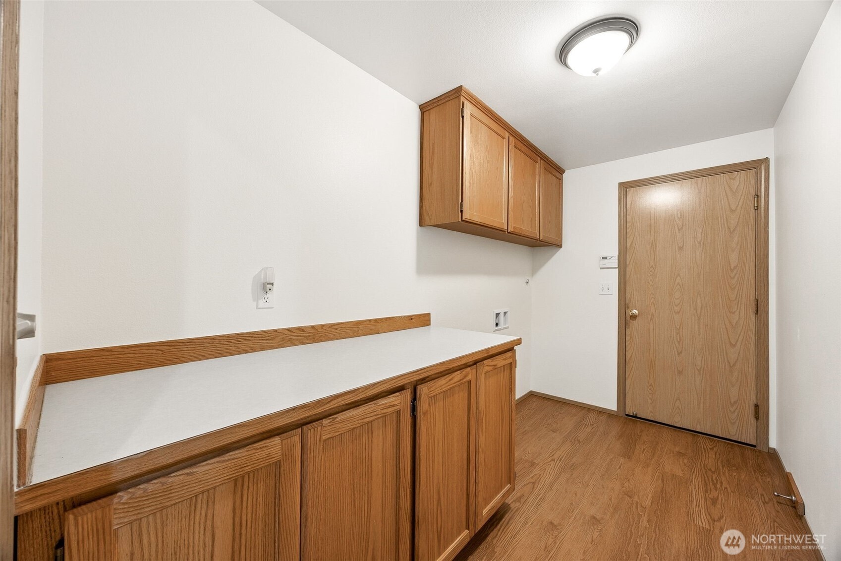 12601 227th Street East Graham, WA 98338 - Photo 17 of 27 a kitchen with a sink and cabinets