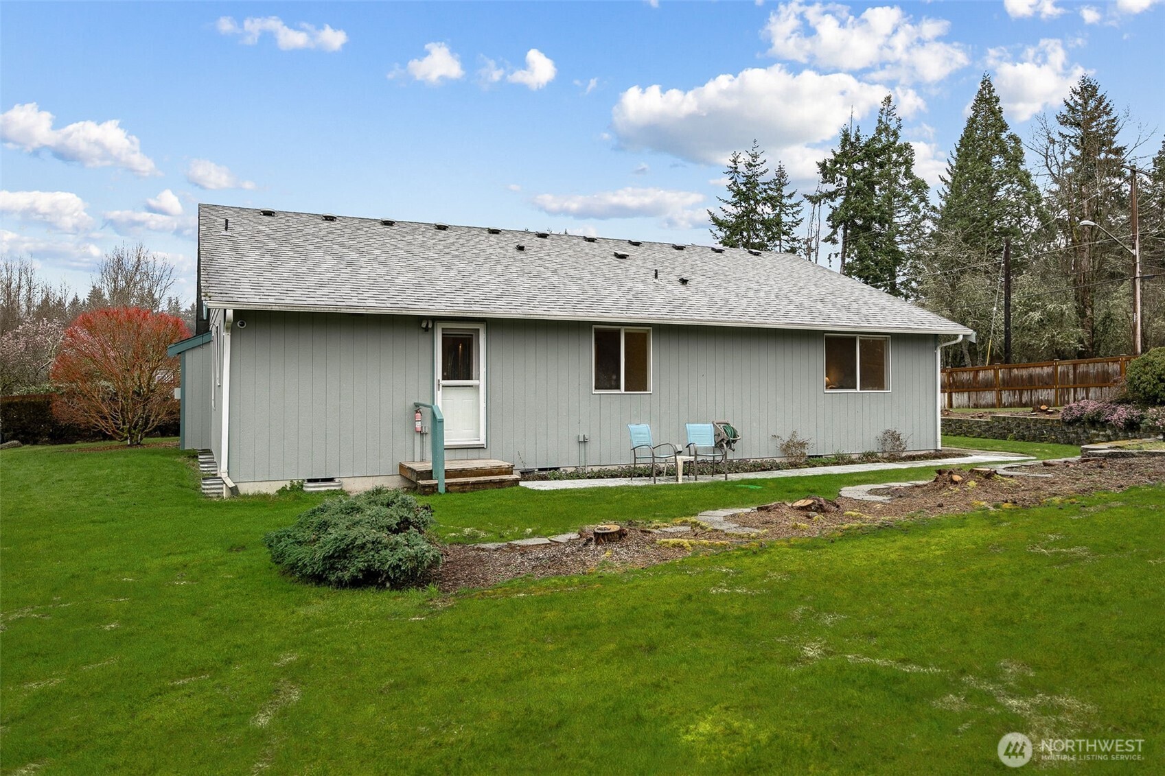 12601 227th Street East Graham, WA 98338 - Photo 23 of 27 a view of a backyard with plants and a garden