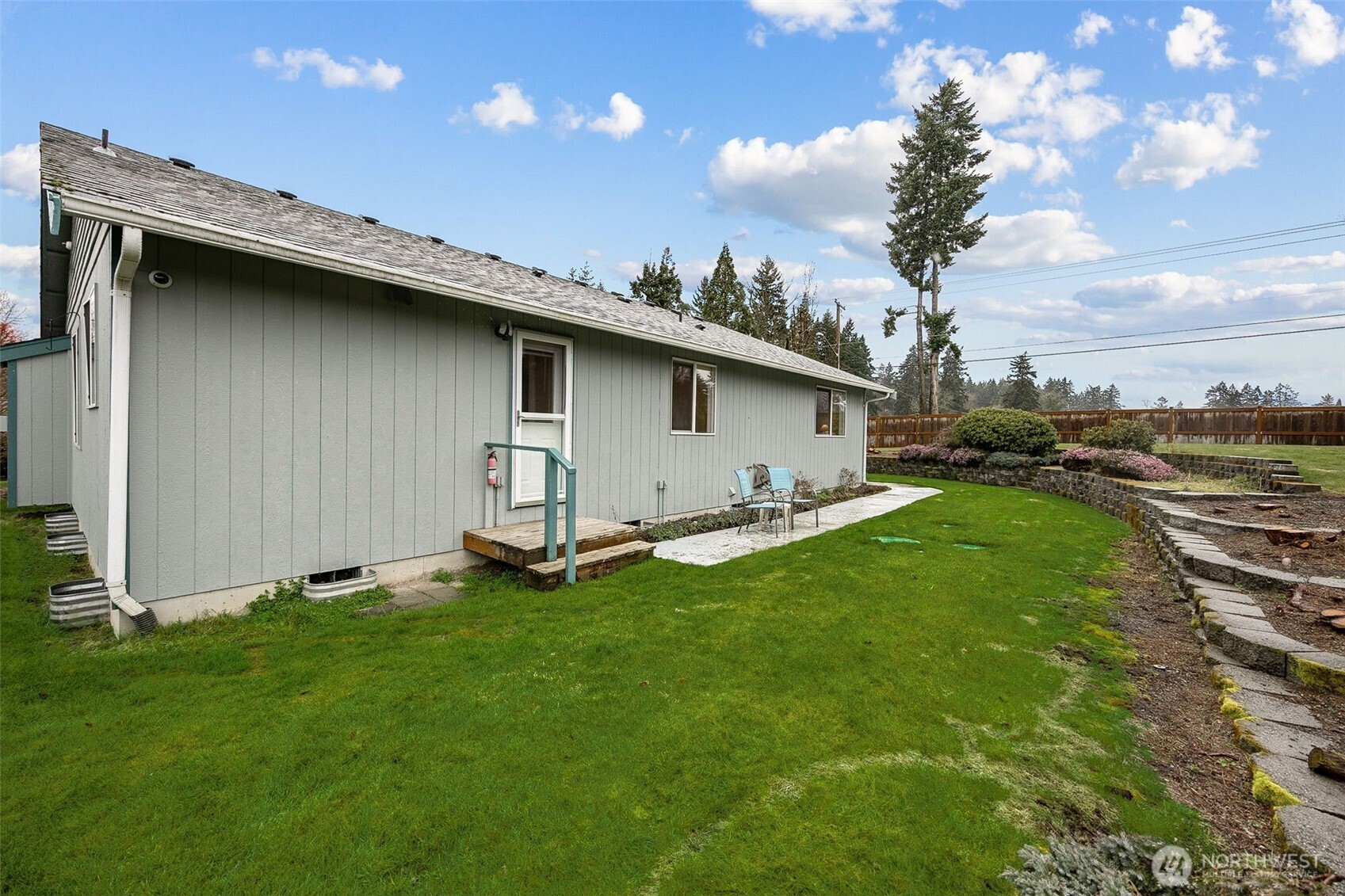 12601 227th Street East Graham, WA 98338 - Photo 25 of 27 a backyard of a house with lots of green space