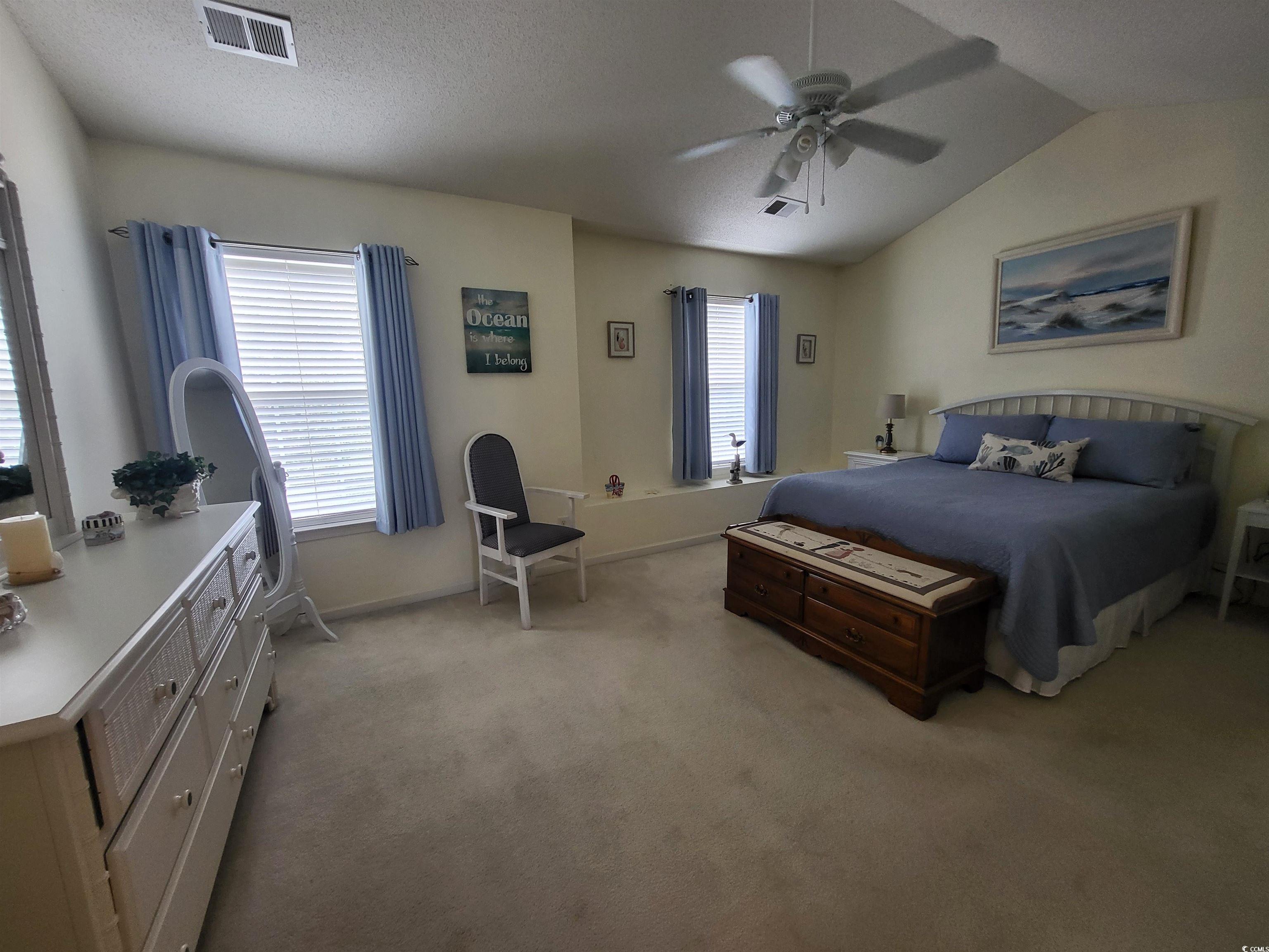 952 Williston Loop, Unit 952 Murrells Inlet, SC 29576 - Photo 16 of 30 Bedroom with ceiling fan, visible vents, vaulted c