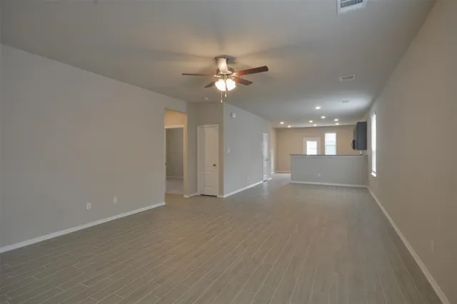 a view of an empty room with a window