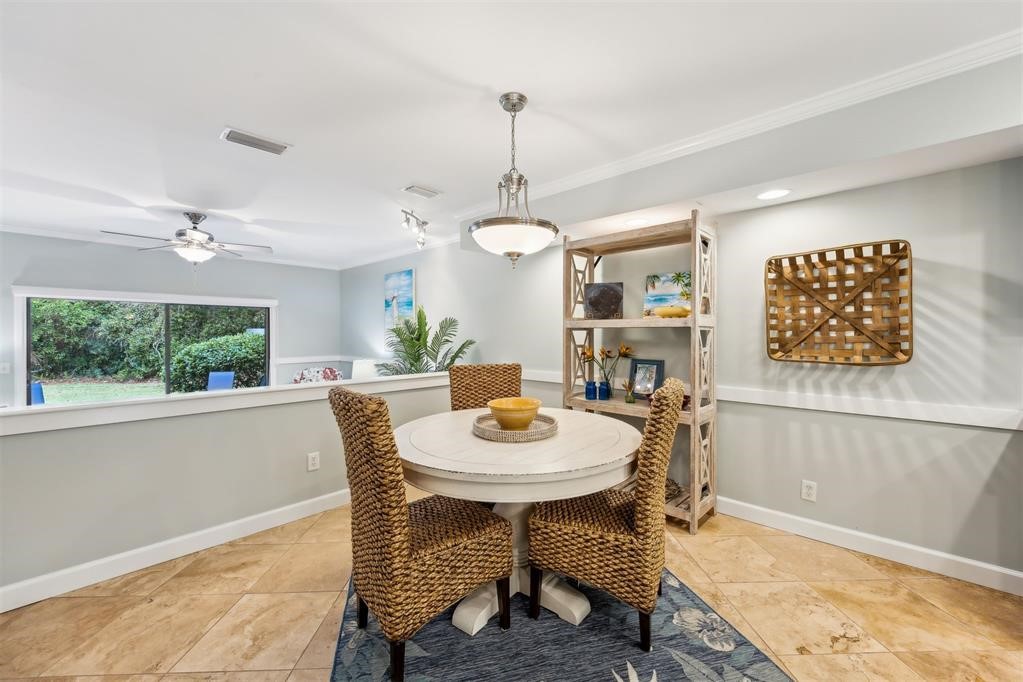 3033 Sea Marsh Road Fernandina Beach, FL 32034 - Photo 14 of 37 a view of a dining room with furniture window and wooden floor
