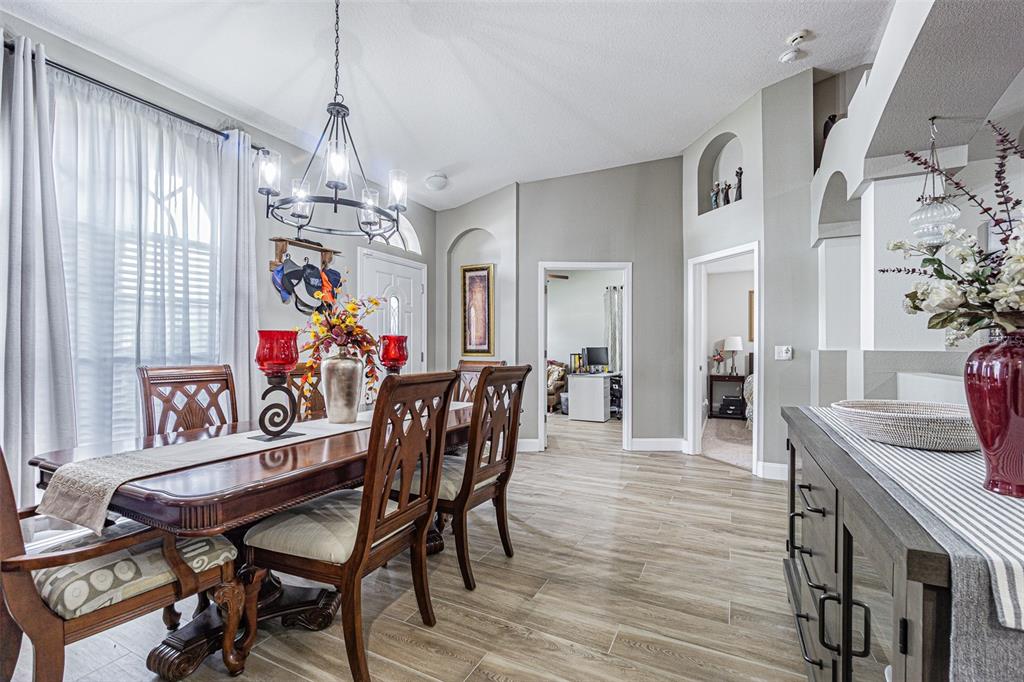 9809 La Rita Place Riverview, FL 33569 - Photo 36 of 59 a view of a dining room with furniture window and wooden floor