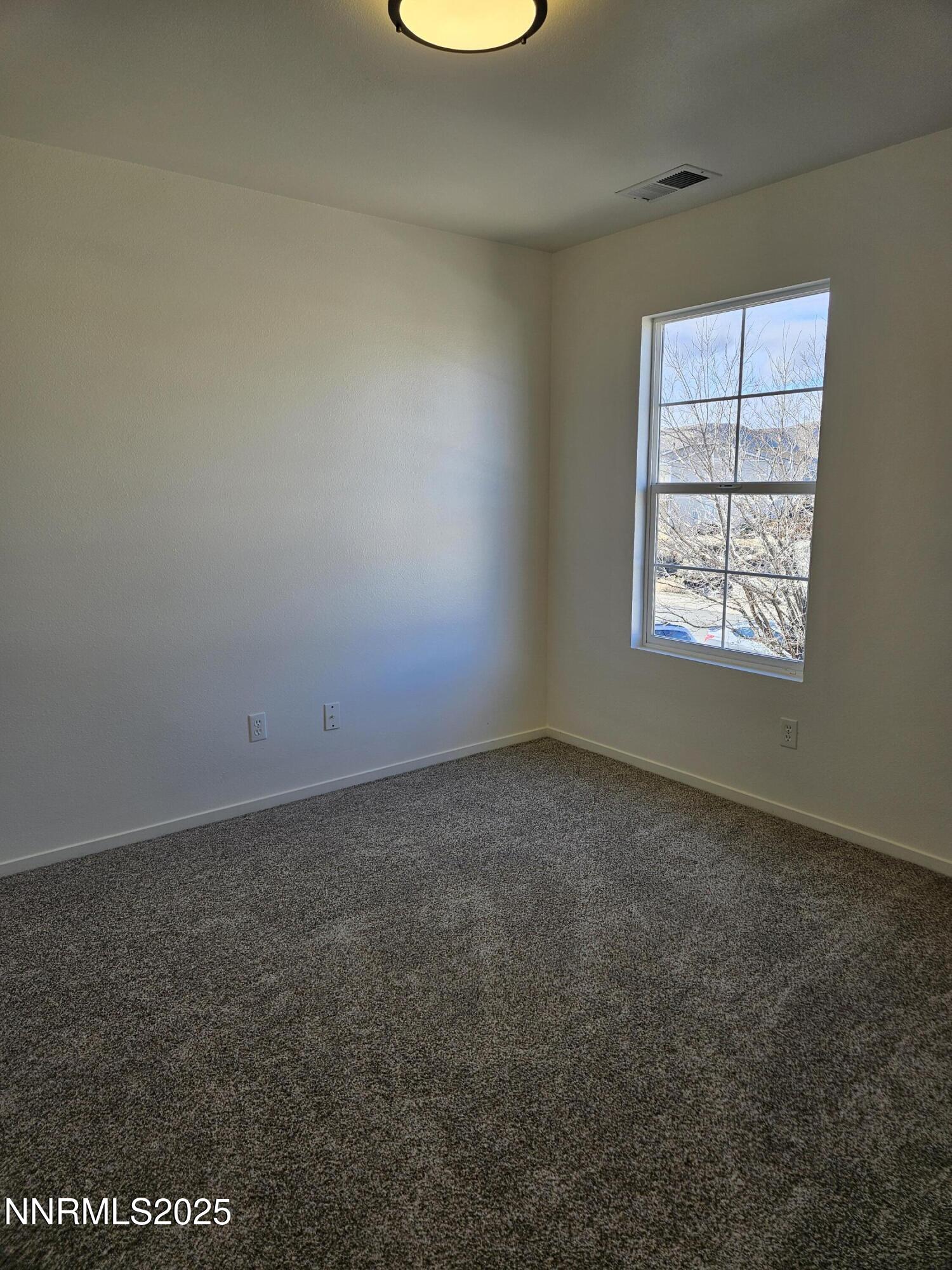 8944 Red Baron Boulevard Reno, NV 89506 - Photo 14 of 17 an empty room with a window
