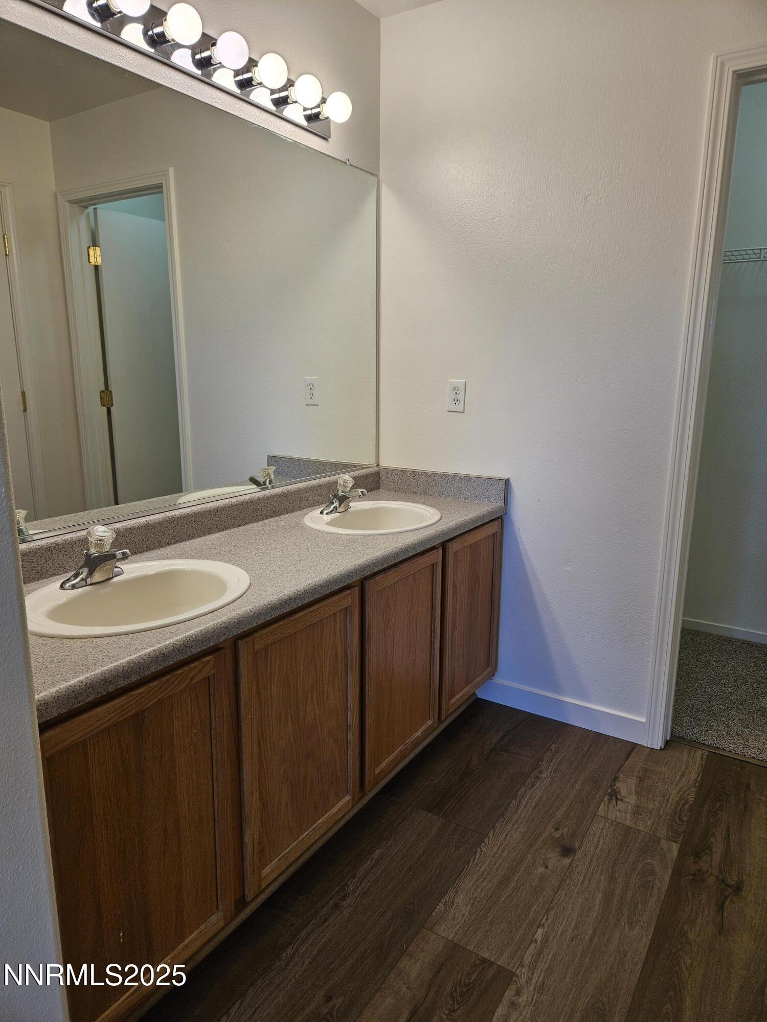 8944 Red Baron Boulevard Reno, NV 89506 - Photo 8 of 17 a bathroom with a sink and a mirror
