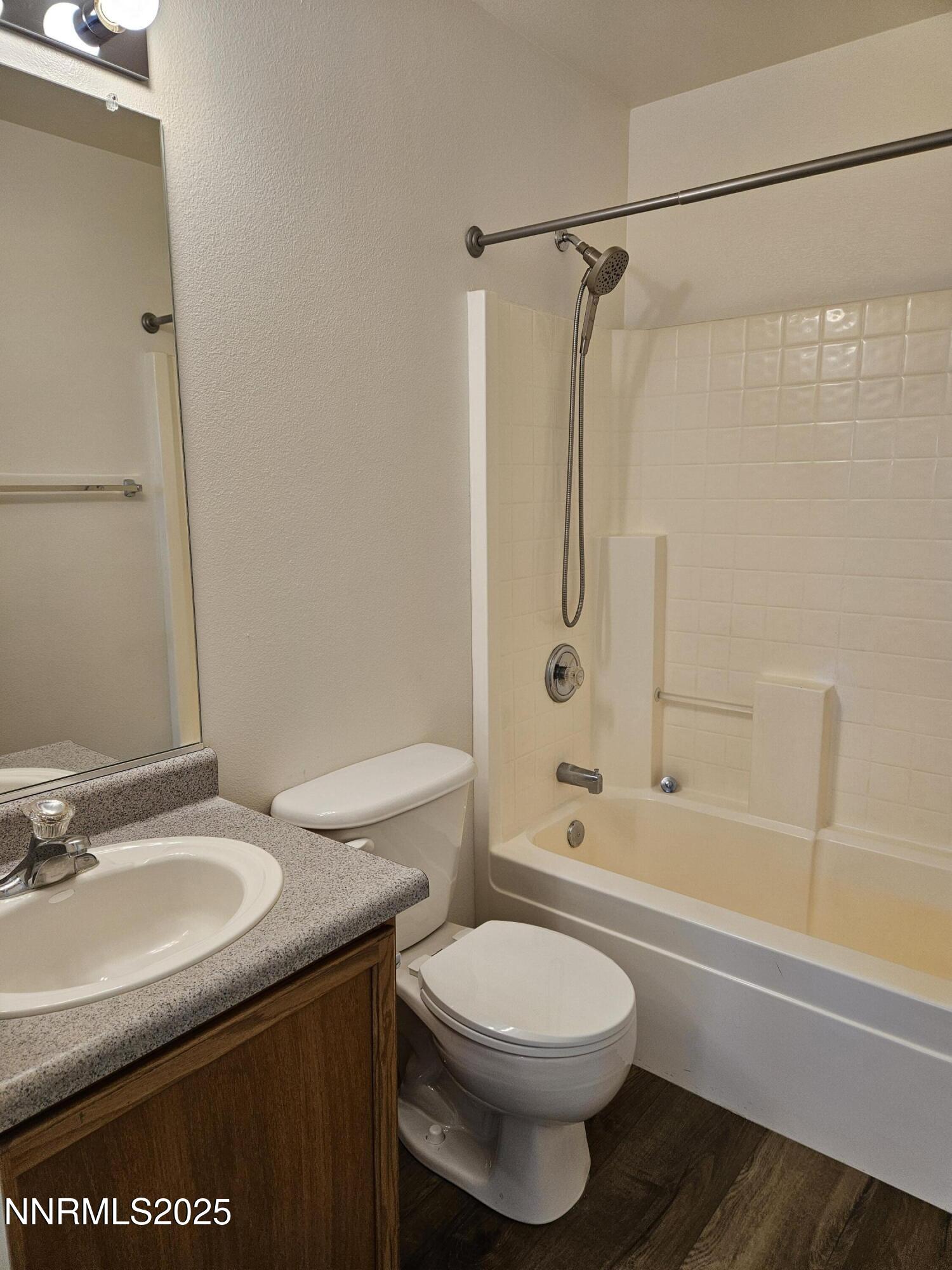 8944 Red Baron Boulevard Reno, NV 89506 - Photo 9 of 17 a bathroom with a sink a toilet and shower