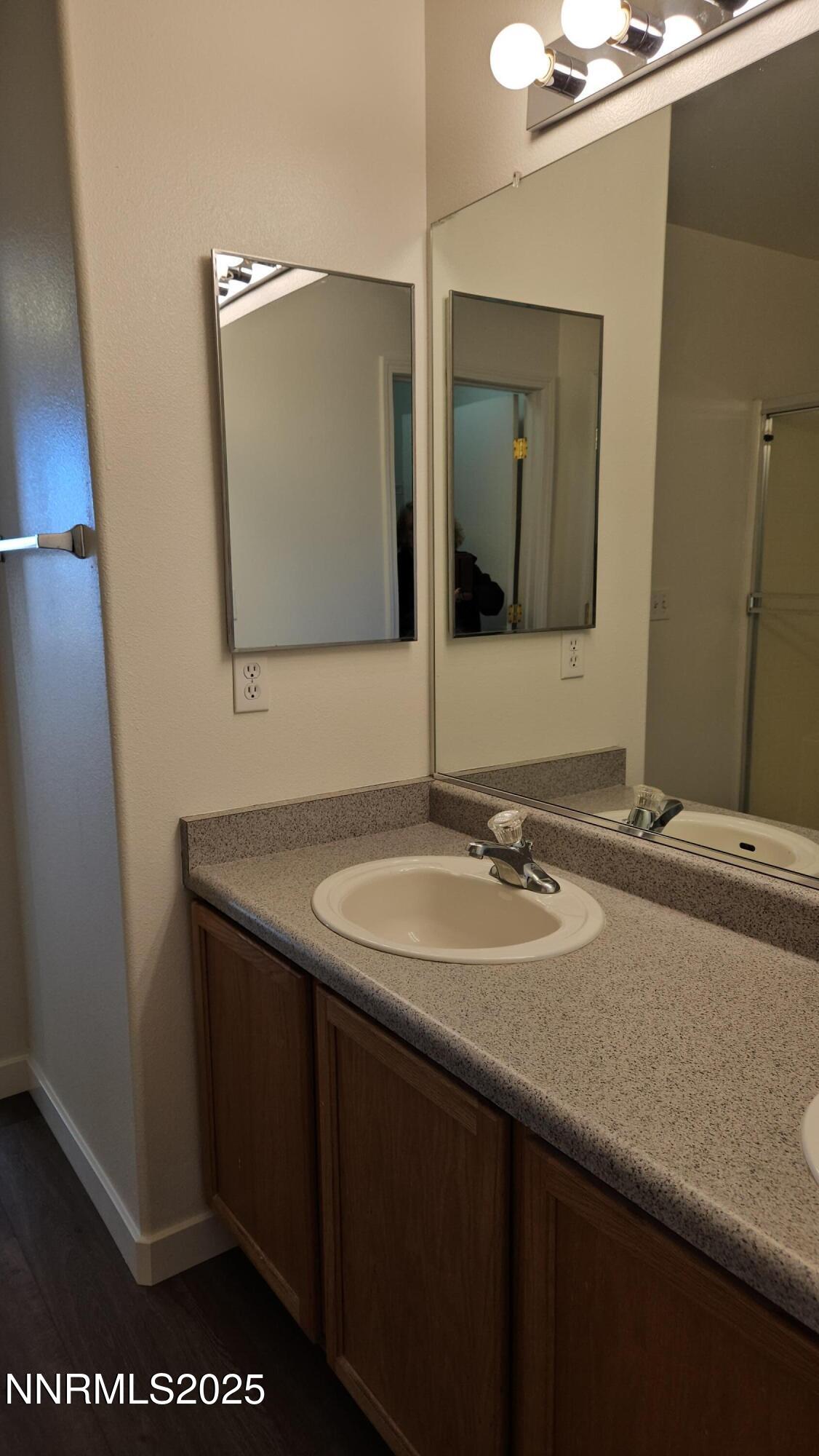 8944 Red Baron Boulevard Reno, NV 89506 - Photo 10 of 17 a bathroom with a sink and a mirror