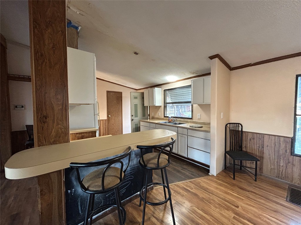 310 E Road Granbury, TX 76049 - Photo 13 of 22 a view of a dining room with furniture and wooden floor