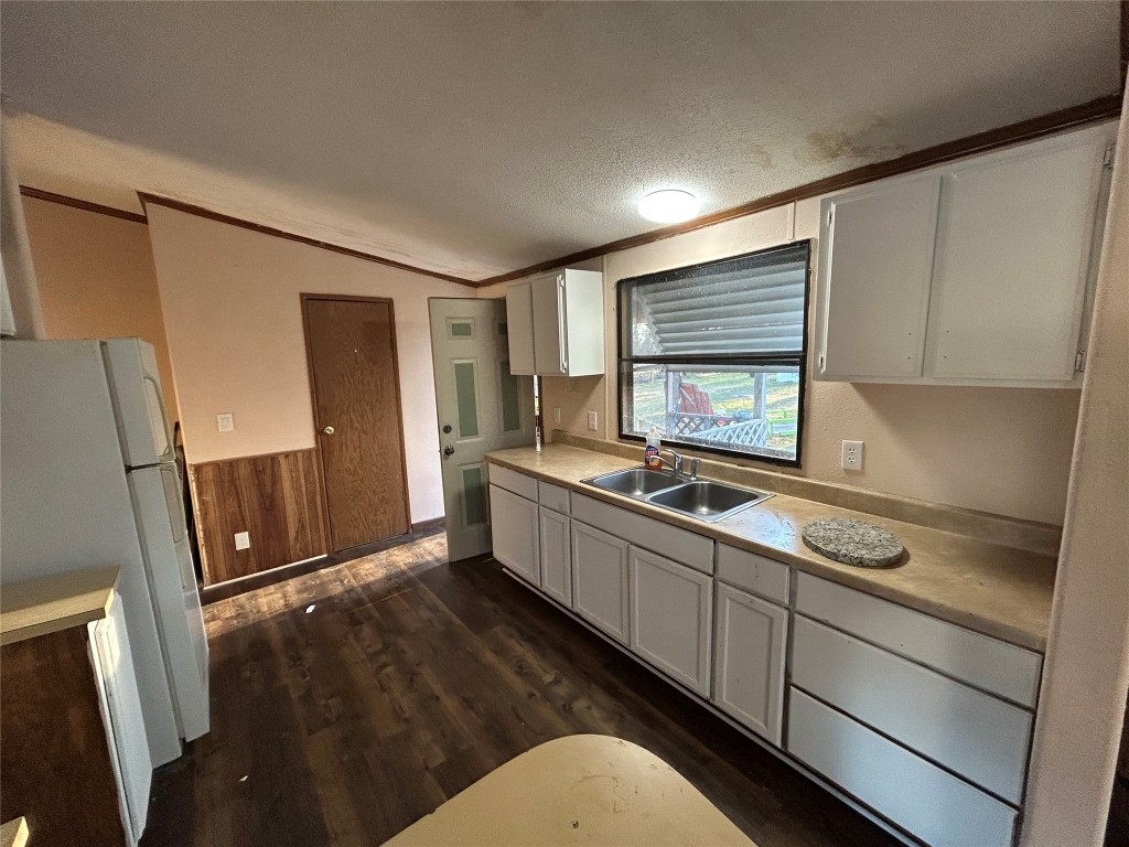 310 E Road Granbury, TX 76049 - Photo 14 of 22 a kitchen with stainless steel appliances a sink stove and refrigerator