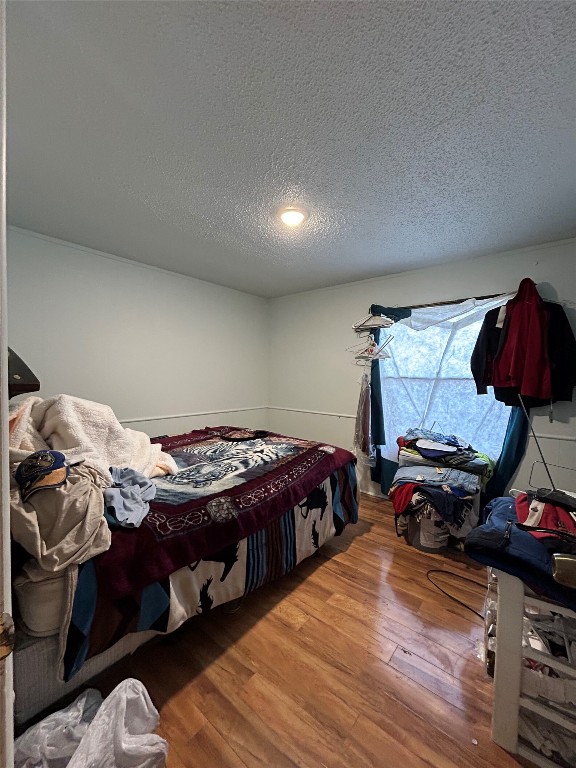 310 E Road Granbury, TX 76049 - Photo 18 of 22 a bedroom with a bed and a closet