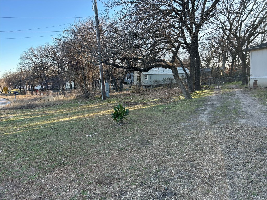310 E Road Granbury, TX 76049 - Photo 5 of 22 a view of road with trees