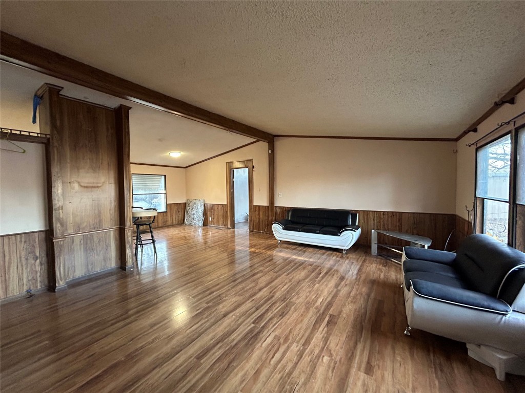 310 E Road Granbury, TX 76049 - Photo 9 of 22 a living room with furniture and a wooden floor