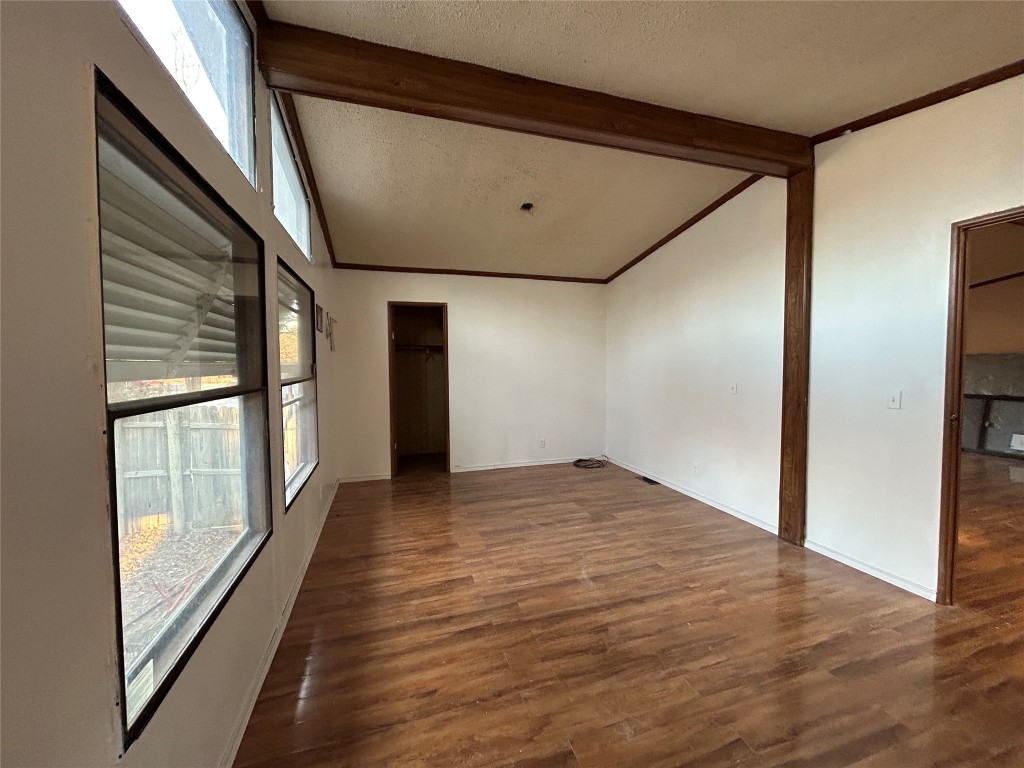 310 E Road Granbury, TX 76049 - Photo 10 of 22 a view of empty room with wooden floor and fan