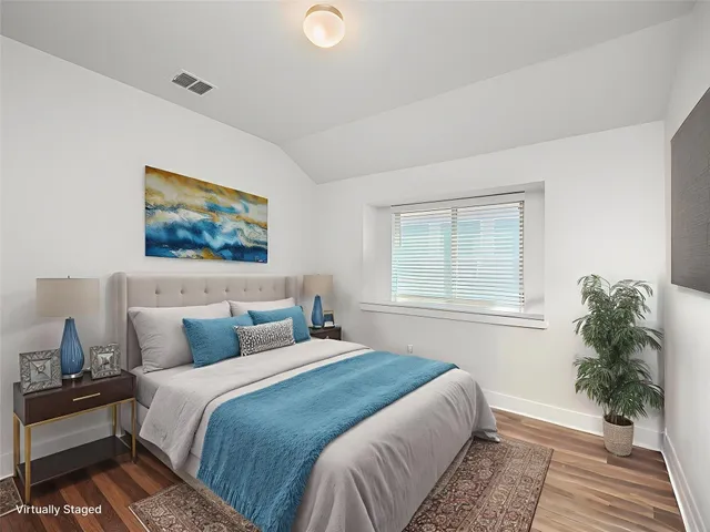 a bedroom with bed and window