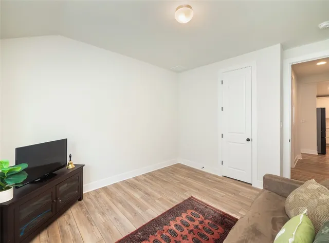 a bedroom with a bed and a television