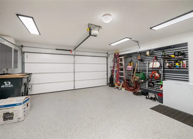 a view of a porch with furniture and garden