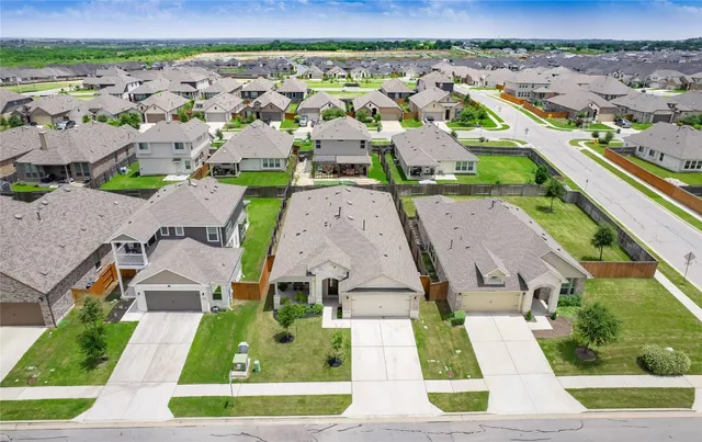 an aerial view of a house with a garden