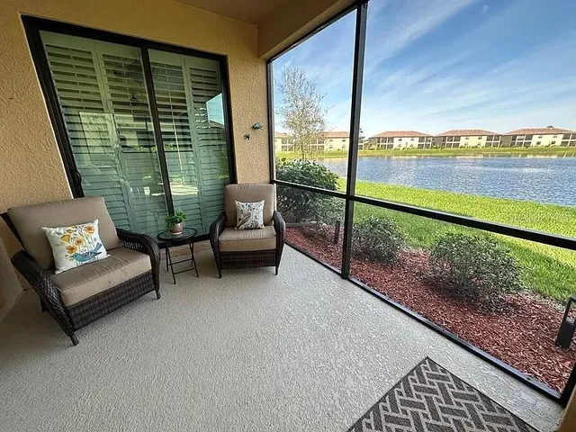 a balcony with furniture and city view