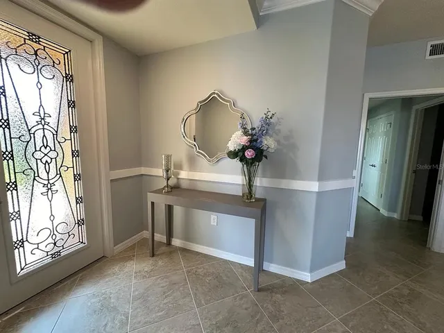 a view of a livingroom with furniture and staircase