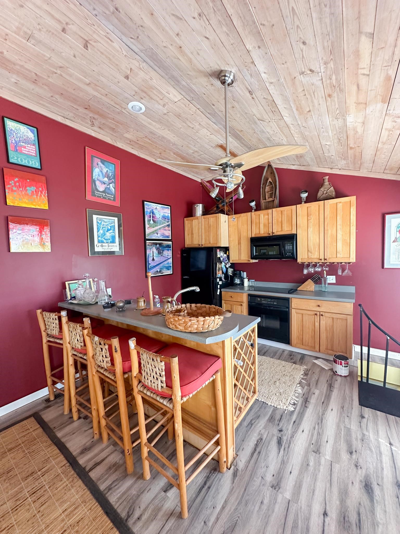 Lot 72 Cr 451 Road Iuka, MS 38852 - Photo 5 of 9 a view of a dining room with furniture a chandelier and wooden floor