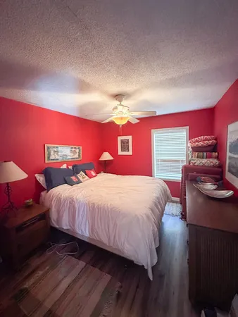 a bedroom with a bed and a closet