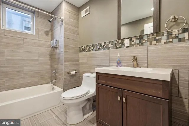 a kitchen with a refrigerator stove and microwave