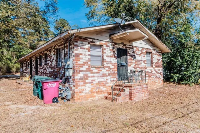 a front view of a house with parking