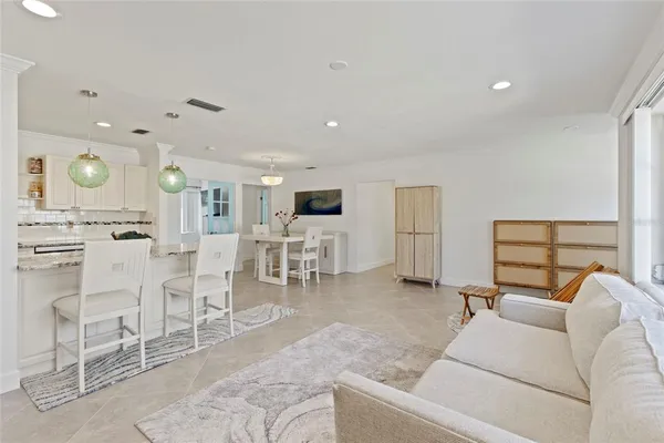 a large kitchen with a table and chairs