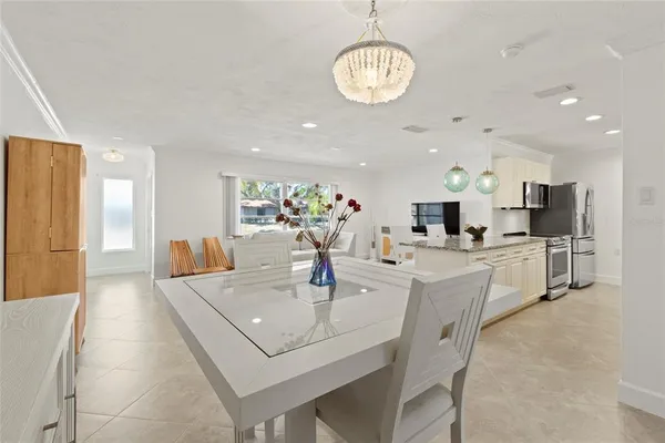 a kitchen with a sink a counter space and cabinets