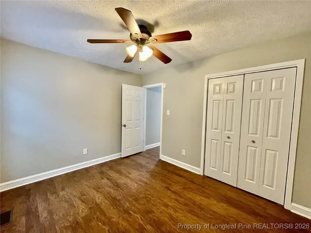 a view of backyard with a deck