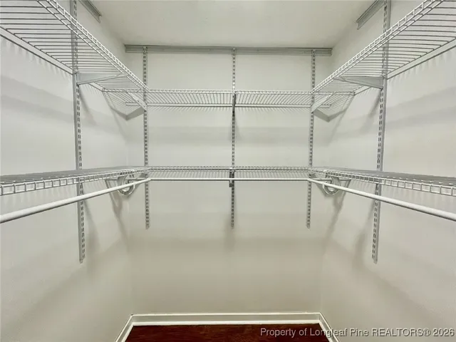 a view of a house with a small yard and flower plants