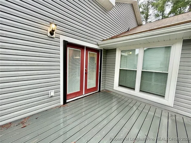 a view of a backyard with sitting area