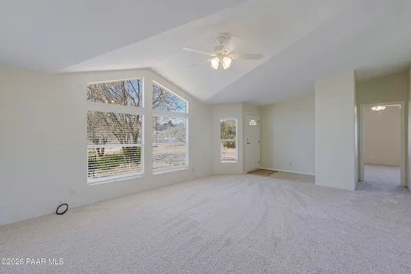a view of an empty room with a window