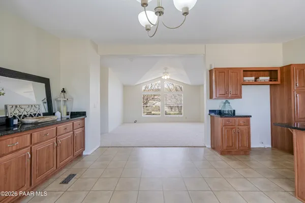 a kitchen with stainless steel appliances a refrigerator and a stove top oven